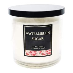 a jar of watermelon sugar sits on a white surface with a black lid