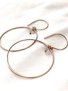 Just as effortless as they are simple, these hoop earrings are an essential everyday piece. Item Details: • This listing is for A PAIR ( 2 pieces ) earrings.• All metal is components are sterling silver and 14k gold-fill• Hoops measure 40mm in diameter.• Herkimer quartz crystals prized, each Herkimer diamond is a natural entity and no stone is identical.• The order will arrive in a gift-wrapped box and free polishing cloth. It will be ready for gift giving. All our work is custom-made by hand in Delicate Everyday Hoop Jewelry, Everyday Simple 14k Gold Jewelry, Everyday Round Huggie Earrings In Recycled Gold, Minimalist Teardrop Gold Plated Hoop Earrings, Dainty Hoop Jewelry For Everyday, Delicate Tarnish Resistant Hoop Earrings For Everyday, Everyday Hoop Jewelry In Recycled Gold, Delicate Everyday Hoop Huggie Earrings, Delicate Everyday Huggie Hoop Earrings