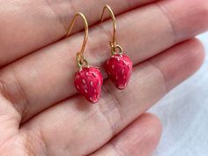 These strawberry dangle earrings are cute and dainty, which are perfect gift for friends and lovers.  They are made of the followings: 🍓Strawberry charm: gold plated over brass with rose red enamel (size: 12 x 8 mm) 🍓Earring hooks and chain: gold plated over brass 【BEFORE PURCHASE, PLEASE NOTE THE FOLLOWINGS】 ☆ VAT, GST and any other taxes from your country are NOT included in the listing price. Buyers are responsible for any aforesaid taxes and must be paid upon delivery. ☆ Buyers are respons Dainty Red Earrings For Everyday, Dainty Handmade Red Earrings, Red Hypoallergenic Dainty Earrings, Whimsical Red Drop Earrings, Cute Handmade Red Earrings, Food Strawberry, Strawberry Jewelry, Miniature Fruit, Strawberry Earrings