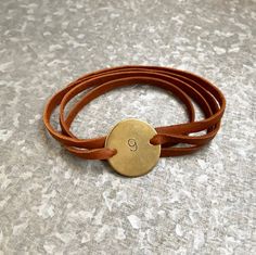 ********Please note jewelry items will ship separately and quicker than the other items in our shop!***********Our bracelets are made of super soft deerskin leather and feature your Enneagram number on a hand stamped 1 inch brass disc. The disc comes strung on 30 inches of supple leather that will fit any size wrist. No clasps to mess with as this easy to wear piece can be wrapped around your wrist as many times as you like, knotted and trimmed to size.Brass is a long lasting metal but will tarn Vintage Brown Wrap Bracelet Gift, Vintage Brown Wrap Bracelet, Vintage Handmade Wrap Bracelet For Gift, Vintage Handmade Wrap Bracelet As Gift, Vintage Handmade Wrap Bracelet Gift, Nickel Free Brown Wrap Bracelet As Gift, Nickel Free Brown Wrap Bracelet For Gift, Brown Hand Stamped Bracelets For Everyday, Nickel-free Brown Wrap Bracelet As Gift