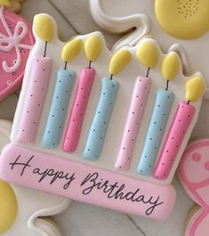 a decorated birthday cake with candles on it