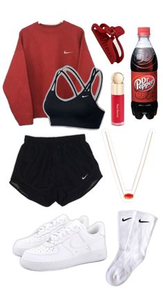 the contents of a woman's sports outfit including sneakers, water bottle and socks