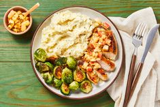 a plate with mashed potatoes, brussel sprouts and brussels sprouts