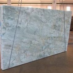 a large blue marble slab sitting on top of a floor