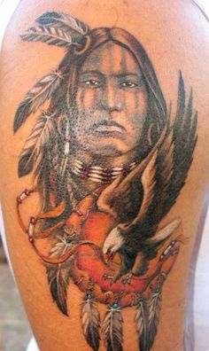 a man with an eagle tattoo on his arm and chest is shown in this photo