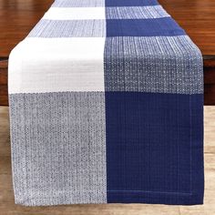 a blue and white checkered table runner