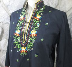 "This is a vintage Esme embroidery blouse. Made in China. 78% Poly/22% viscose. Tag is for Lily. Beautiful embroidered yoke and neck, cuffs and hem. Excellent condition. Tag says it is a 38. Fits up to a 38\" bust. Length is about 25\" from top of shoulder to bottom edge." Folk Style Embroidered Top With Embroidered Hem For Fall, Folk Style Embroidered Top For Fall, Fall Folk Style Embroidered Top, Traditional Long Sleeve Top With Embroidered Cuffs, Traditional Long Sleeve Embroidered Top With Embroidered Cuffs, Traditional Fall Blouse With Embroidered Hem, Traditional Embroidered Hem Tops For Fall, Traditional Fall Tops With Embroidered Hem, Traditional Embroidered Fitted Top For Fall