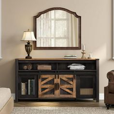 a living room with a couch, chair and mirror