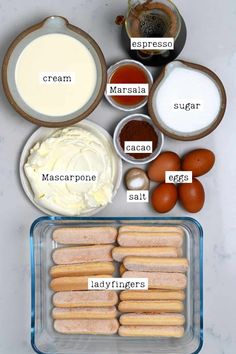 ingredients to make an english muffin recipe laid out on a white counter top, including eggs, cream, mayonnaise and sugar