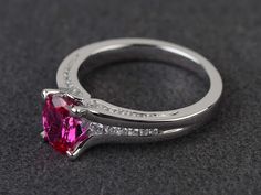 Welcome to my shop, you can find many beautiful gemstone jewelry here, and you also can ask for customized service. Main Stone: lab creatd ruby, oval cut, measures 6X8 mm, weight 1.73 carats. Accent Stones: cz Metal: 925 sterling silver plated with rhodium so as to protect the ring from tarnish and keep it shinning. I also can provide metal options such as 14k solid yellow/white/rose gold Setting: prong setting more rings: https://www.etsy.com/shop/XCjewelryStudio?ref=hdr_shop_menu It's quite co Red Ruby Ring, Vintage Diamond Jewelry, July Birthstone Ring, Oval Engagement Ring, Jewelry Lockets, Oval Engagement, Jewelry Rings Diamond, Engagement Rings Oval, Uncut Diamond