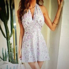 Lavender And White Floral Halter Dress. Deep Plunge. Tie Neck And Back. Elasticed Back With Zipper. 36” Long. Bust:39 Waist 31” Hip 42” 95% Polyester. 5% Elastane Spring V-neck Halter Dress For Garden Party, Lavender V-neck Mini Dress For Beach, Summer Halter V-neck Dress For Brunch, Summer V-neck Halter Dress For Brunch, Lavender V-neck Beach Dress, Feminine Purple Mini Dress For Beach, Feminine Lavender Mini Dress For Summer, Spring Lavender Mini Dress For Beach, Summer Lavender Feminine Mini Dress