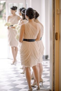 the bridesmaids are getting ready to walk down the aisle