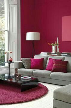 a living room with pink walls and furniture in the center, on instagram for pinterest