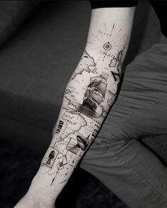 a person with a tattoo on their arm that has pictures and words all over it