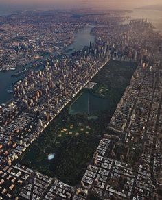 an aerial view of a city with lots of tall buildings