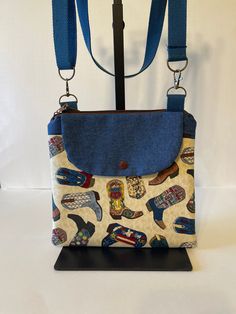 Hey there from sun-kissed Tucson! Debbie here 🌵. In a world of endless choices, isn't it wonderful when one accessory can wear so many hats?  Does the sane "watch my bag" sound familiar, well not anymore.  This zippered 11 x 10 accompanied by a generous front snap pocket crossbody bag will go everywhere you go, rather at an event, line dancing or whatever dancing you're into, it fits snug against your body.  And style? Oh, it's sewn right in! Choose from an array of patterns, each echoing a different rhythm, a different story, a different you. Step out with confidence, and let every day be a statement. Debbie 💕 Adjustable Tote Shoulder Bag For Travel, Casual Handmade Bag With Adjustable Strap, Adjustable Shoulder Bag With Removable Pouch For Travel, Casual Handmade Bags With Adjustable Strap, Casual Travel Shoulder Bag With Adjustable Strap, Trendy Adjustable Travel Bags, Casual Handmade Adjustable Shoulder Bag, Casual Adjustable Handmade Shoulder Bag, Adjustable Canvas Bags For Everyday Use