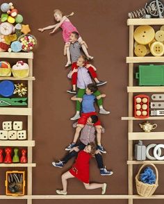 an image of children playing on shelves with toys in the background and text above it