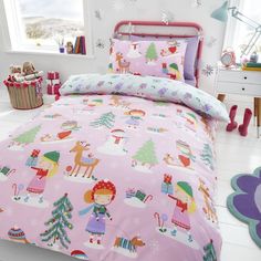 a child's bedroom with pink bedding and christmas decorations