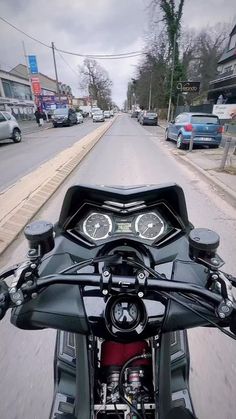 the front view of a motorcycle on a city street