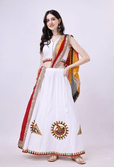 Celebrate the vibrant spirit of Navratri in elegance with our stunning White Chaniya Choli ensemble, thoughtfully crafted for this festive season. Made from luxurious rayon cotton fabric, this sleeveless Choli and Chaniya combine comfort with style seamlessly. What makes our Chaniya Choli truly exceptional is the meticulous attention to detail. Authentic garba laces embellish the entire outfit, infusing it with the lively essence of the Garba dance, paying homage to the rich traditions of Navratri celebrations. To perfect your look, we've included a vibrant dupatta that adds the ideal finishing touch to your attire. Whether you're dancing the night away or partaking in Navratri festivities, our White Chaniya Choli radiates grace and style. Embrace the joy of Navratri with this exquisite ou White Chaniya Choli, White Chaniya, Indian Traditional Outfits, Chaniya Choli For Navratri, Party Wear Lengha, Designer Chaniya Choli, Choli For Navratri, Bollywood Dress, Lengha Choli