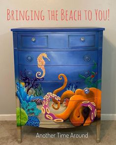 a dresser painted with an octopus and seahorse on the bottom, next to a wall that says bring the beach to you