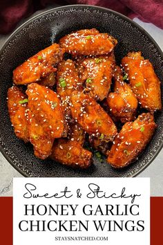 sweet and sticky honey garlic chicken wings in a black bowl