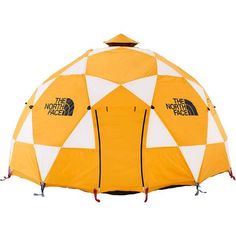 a yellow and white tent with the north face logo on it's front side