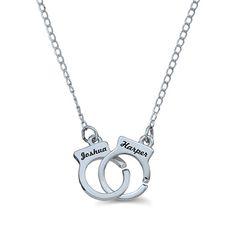 She’ll adore the cute and quirky design of this Personalized couple's necklace. Crafted in your choice of silver or gold, this charming piece features a pair of interlocking handcuffs customized with the two names you choose, each up to 8 characters in length, written in an attractive cursive font. Polished to a bright shine and sure to hold her smile for a while, this delightful 18.0-inch necklace secures with a spring-ring clasp. Relationship Necklaces, Matching Necklaces For Couples, Handcuff Necklace, Couples Necklace, Couple Stuff, Bf Gifts, Best Friend Jewelry, Cursive Font, Best Friend Necklaces