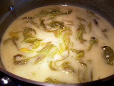 the food is being cooked in the pot on the stove