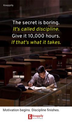 a man sitting at a desk with a book in front of him and the caption above it