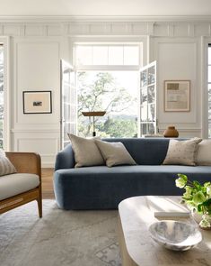 a living room filled with furniture and decor