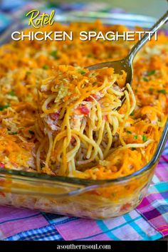 a glass casserole dish filled with pasta and cheese, topped with a fork