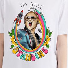 a person wearing a t - shirt that says i'm still standing