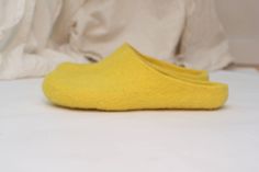 Felted slippers for women of bright yellow wool - an excellent gift for Christmas, birthday or housewarming. Felt is a perfect material for footwear. It is extremely wear-proof and warm. When you put them on, you won't want to take the slippers off. They will definitely make a part of your home outfit. Non-slip sole is covered with natural latex. Now slippers are also available in rubber soles. Please follow the link if interested https://www.etsy.com/listing/100254500/rubber-soles-for-felted-sl Comfortable Yellow Flat Slippers, Yellow Casual Flat Slippers, Casual Yellow Flat Slippers, Casual Yellow Slippers With Rubber Sole, Yellow Non-slip Slippers With Round Toe, Yellow Non-slip Round Toe Slippers, Comfortable Yellow Slip-on Slippers, Comfortable Non-slip Yellow Slippers, Comfortable Yellow Non-slip Slippers