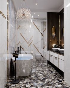 an elegant bathroom with marble floors and white tub, chandelier above the bathtub