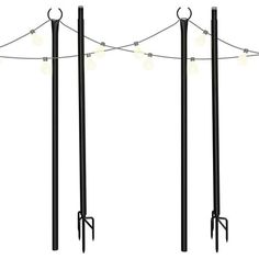 three black poles with lights on them and one pole has two long poles attached to it