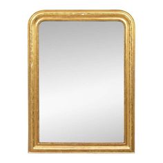 a gold framed mirror on a white wall