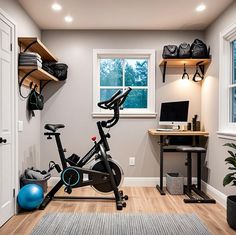 there is a bike and exercise equipment in this home gym room with wood flooring