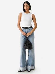 DESCRIPTION:A waist-accentuating high-rise jean featuring a wide-leg silhouette with an untacked cuffed hem.FEATURES:High Rise - 12.5 in.Button-Fly ClosureBelt Loops5-Pocket StylingCuffed HemWide Leg SilhouetteInseam: 32.5 in.Denim Fabrication100% Recycled CottonClassic FitModel is wearing size 25 jean.Model's Measurements: Height: 5'8" | Bust: 32A | Waist: 25.5" | Hips: 35" | Dress Size: 0-2 (US) High Rise Wide Leg Jeans, Saint Bernard, High Rise Jeans, Wide Leg, High Rise, How To Wear