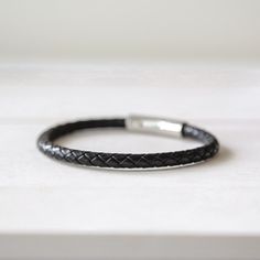 DARKHORSE - Men's Leather Bracelet - Mack & Rex Black Leather Bracelet With Stainless Steel Clasp For Business, Adjustable Black Leather Bracelet With Lobster Clasp, Black Leather And Stainless Steel Adjustable Bracelet, Classic Black Braided Bracelets For Everyday, Classic Black Braided Bracelets, Modern Leather Bracelet With Black Band, Classic Leather Jewelry With Black Band, Adjustable Black Leather Bracelet With Stainless Steel Clasp, Black Engraved Bracelets For Everyday