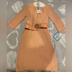 Moschino Cheap Chic Cocktail Dress, Apricot Color, Belt With Beautiful Buckle In The Front, 3/4 Sleeve, Above The Knee Length. Brand New With Tags. Elegant Dress Could Be Useful For Any Occasion, From A Cocktail Party To A Wedding Brunch Or More. Size Runs More Like 2-4, Skinny 4 Looks Great. Fitted Orange Midi Dress For Formal Occasions, Orange Long Sleeve Formal Midi Dress, Formal Orange Long Sleeve Midi Dress, Elegant Knee-length Apricot Dress, Orange Knee-length Dress For Work, Orange Long Sleeve Formal Dress, Orange Formal Dress For Spring, Chic Orange Formal Dress, Elegant Orange Formal Dress