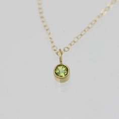 Peridot Drop Necklace, Lrg. in 14k Yellow Gold Classic 14k Gold May Birthstone Necklace, May Birthstone Necklace In 14k Yellow Gold, May Birthstone Yellow Gold Necklace, Minimalist 14k Gold Charm Necklace With May Birthstone, Everyday 14k Yellow Gold Birthstone Necklace, Gold Peridot Round Pendant Necklace, Gold Necklace With Round Peridot Pendant, Faceted Yellow Gold Necklaces For May Birthstone, Dainty Peridot Jewelry In Yellow Gold