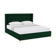 a bed with white pillows and green headboard