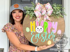 a woman holding up a happy easter sign