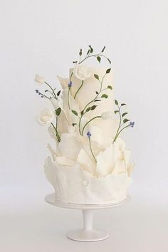 there is a white cake with flowers on it