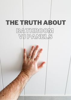 a person's hand reaching up against the wall with text that reads, the truth about bathroom vj panels