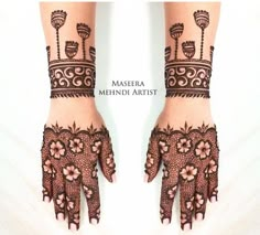 two hands with henna designs on them and the words masera mehndi artist