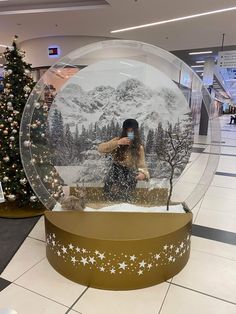 a snow globe in the middle of a shopping mall