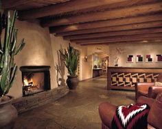 a living room filled with furniture and a fire place