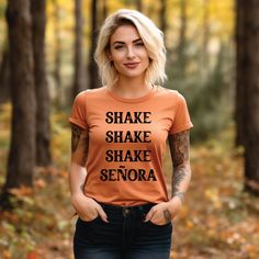 Shake Shake Shake Señora Shirt, Happy Halloween Shirt, Halloween Shirt, Funny Halloween Shirt, Halloween Costume, Spooky Season Shirt, Halloween Party Tee, Spooky Nights Shirt, Halloween Gift, Retro Halloween,  It's the Most Wonderful Time of the Year Halloween Shirt,  HOW TO ORDER T-SHIRT 1-) Please, Check and Review all Photos. 2-) Select Your T-shirt Color. 3-) Select Your T-shirt Size. 4-) Click ADD TO CART and You can go back to add more product color and text color or You can complete the Fitted Orange Tops For Halloween, Halloween Costume Spooky, Happy Halloween Shirt, Shake Shake, Retro Halloween, Night Shirt, Funny Halloween, Halloween Gift, Halloween Funny